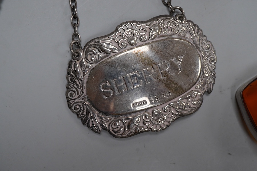 A collection of jewels, comprising: two amber pendants and an amber ring, each mounted in silver; a pair of gilt metal and enamel earrings of floral design; a pair of gilt metal earrings; a silver and cultured brooch; a